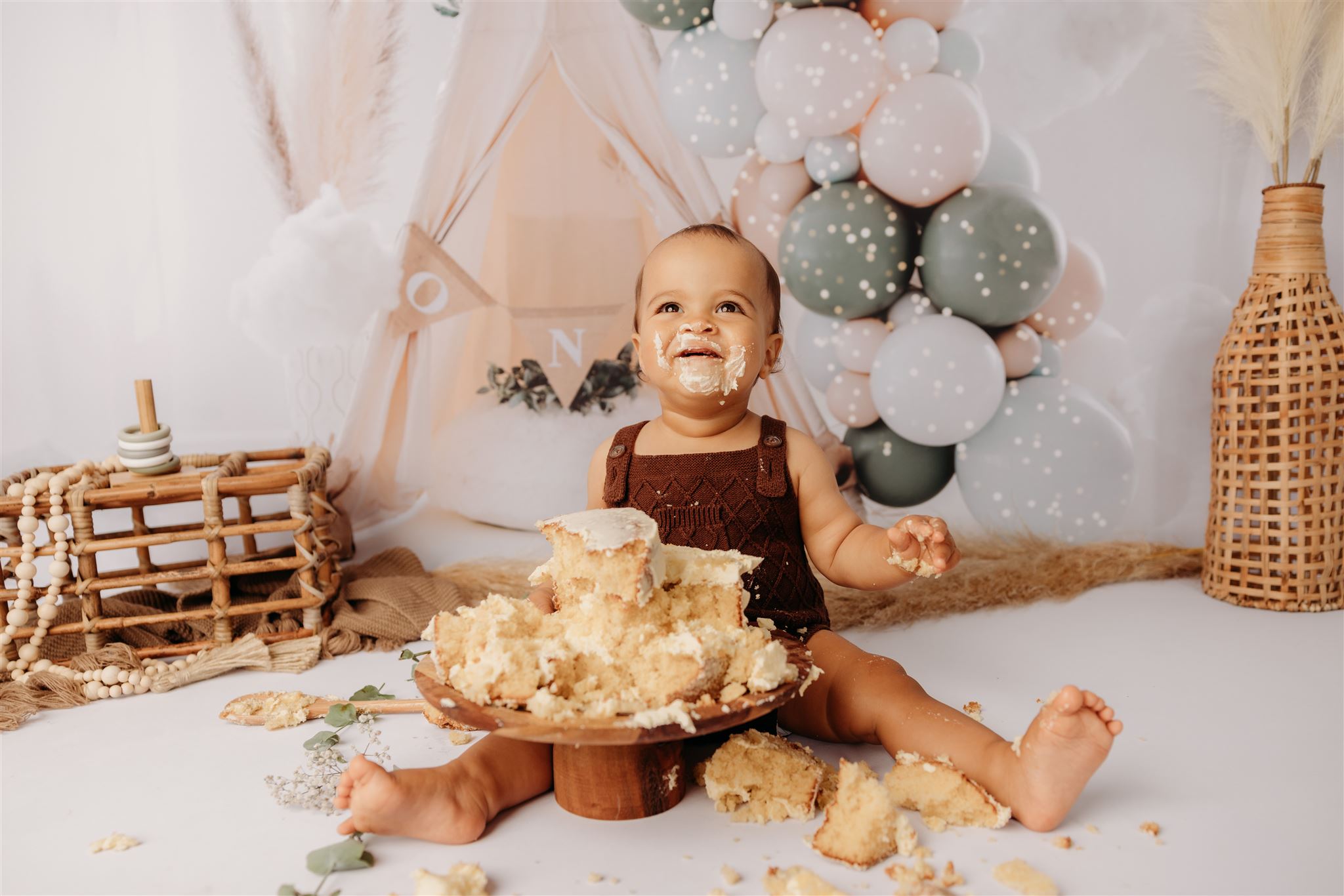 Baby Elijah during her studio cakesmash photoshoot in auckland photographed by papakura newborn baby photographer michelle kelly photography