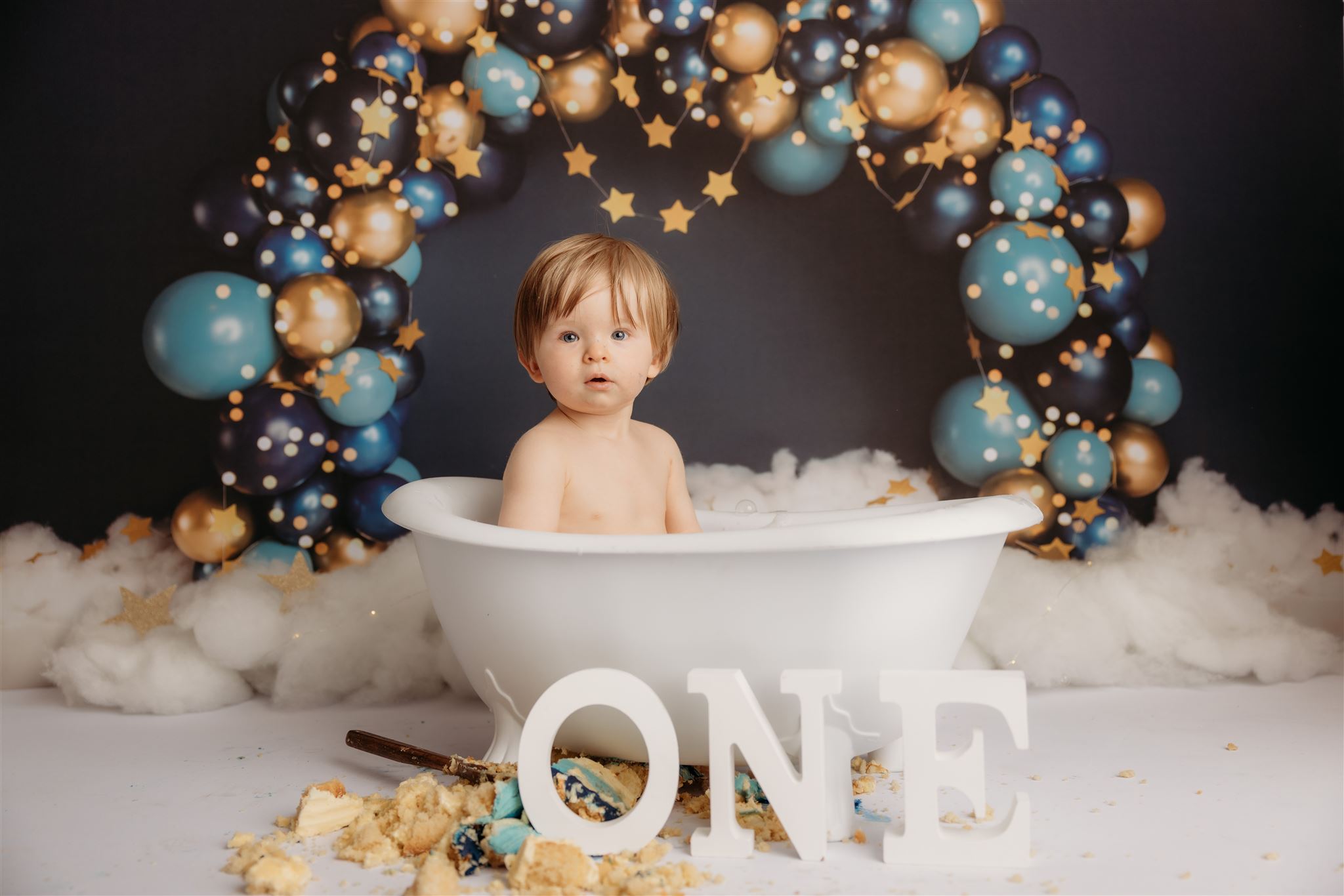 Baby Torben during his cakesmash photoshoot with auckland baby photographer michelle kelly in her papakura newborn photography studio