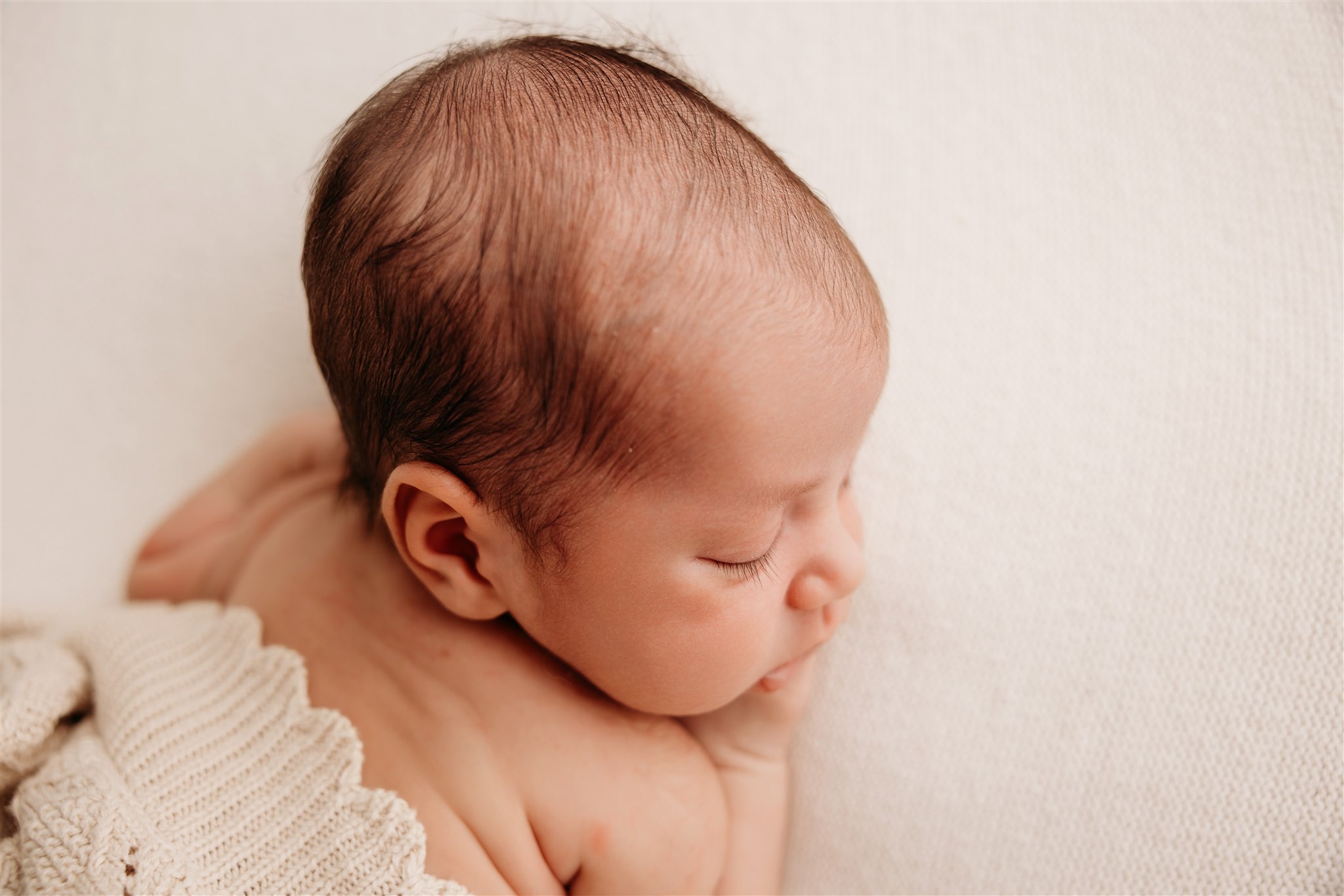 Newborn baby boy during newborn photoshoot with Michelle Kelly Photography in Auckland